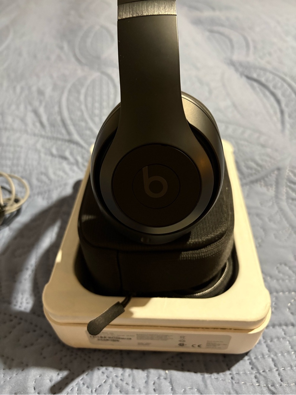 Beats by Dre Beats Studio Pro wireless headphones with cords and charger.